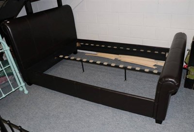 Lot 1230 - Dark brown faux leather double bedstead, modern, 146cm by 230cm by 108cm