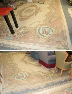 Lot 1248 - Pair of Indian 'Savonneri' design carpets, each with cream ground and central floral medallion...