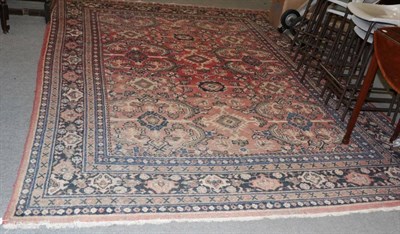 Lot 1260 - Mahal carpet, the faded blood red field with columns of medallions and serrated leaves enclosed...