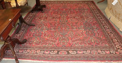 Lot 1262 - Mahal carpet, the blood red field with columns of semi naturalistic flowers enclosed by narrow...