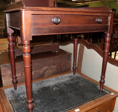 Lot 1287 - A 19th century mahogany writing table, on turned legs with gallery back, 84cm by 50cm, 82cm high