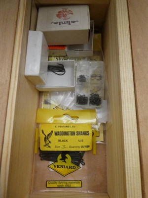 Lot 25 - A collection of fly-tying equipment and accessories, contained in a fitted plywood and pine...