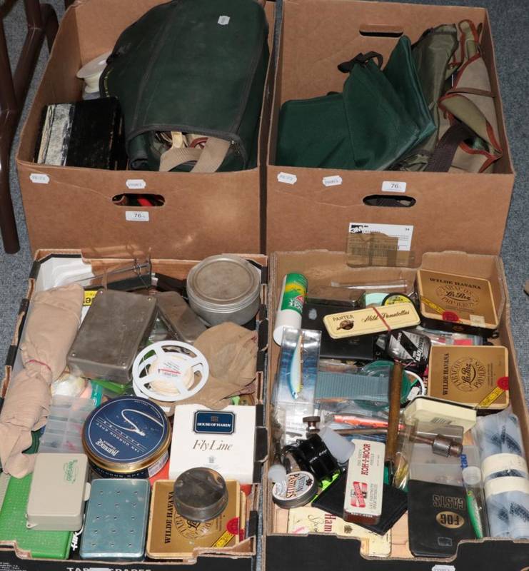 Lot 76 - Four boxes containing an assortment of fishing tackle and accessories, including flies, casts...