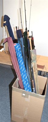 Lot 91 - Twenty-three various carbon fibre and graphite fishing rods, mostly in well-used condition,...