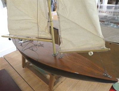 Lot 135 - The Alexander Miniature Pond Yacht with wooden hull, lined decking and aluminium mast; bears...