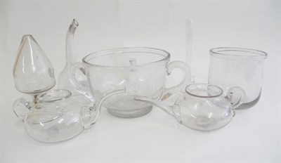 Lot 5 - A Clear Glass Invalid Feeder, early 19th century, of compressed cushion form with C shape...