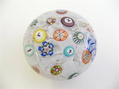 Lot 8 - A Baccarat Paperweight, 1848, the scrambled latticinio ground with cut canes containing...