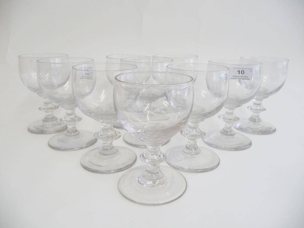 Lot 10 - A Set of Ten Wine Glasses, early 19th century, each with half round bowls on blade knopped...