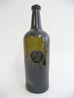 Lot 12 - A Green Glass ALL SOULS COMMON ROOM Sealed Wine Bottle, early 19th century, the cylindrical...