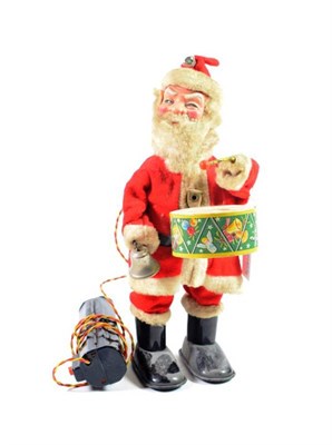 Lot 316 - Made In Japan Battery Operated Remote Control Santa Claus playing a drum and bell, with...