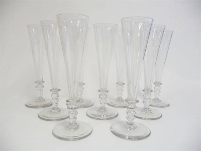Lot 22 - A Set of Nine Champagne Flutes, Regency, circa 1820, each slender trumpet bowl on a triple...