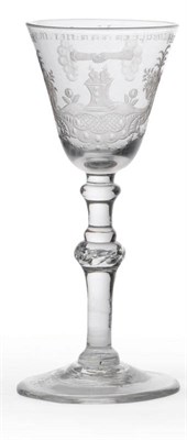 Lot 29 - A Newcastle Light Baluster Wine Glass, circa 1740, the round funnel bowl Dutch engraved with...