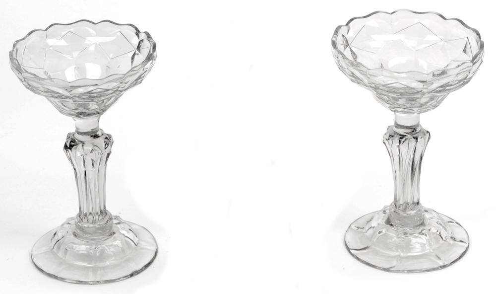 Lot 36 - A Pair of Glass Sweetmeat Dishes, mid 18th century, the diamond cut ogee bowls on panelled pedestal