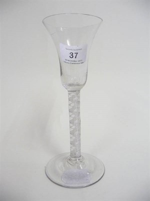 Lot 37 - An English Wine Glass, circa 1760, the bell shaped bowl on a double series air and opaque twist...