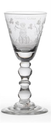 Lot 40 - A Wine Glass, circa 1730, the rounded funnel bowl engraved with Bacchus astride a barrel flanked by