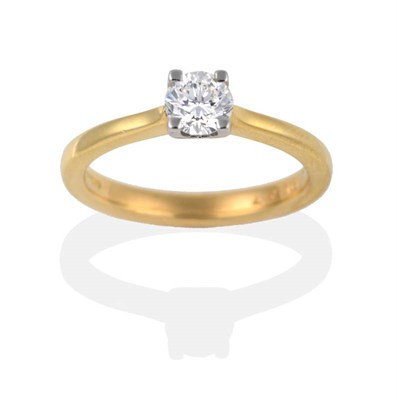 Lot 2000 - An 18 Carat Gold Diamond Solitaire Ring, a round brilliant cut diamond in a claw setting, to...