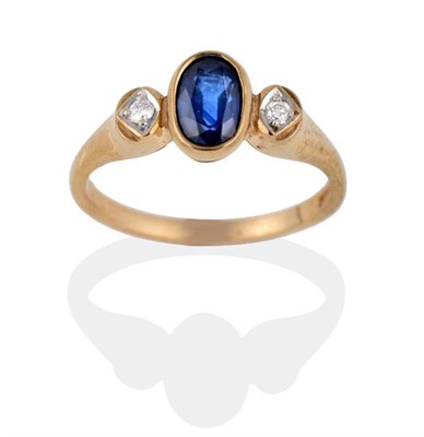 Lot 2008 - A 9 Carat Gold Sapphire and Diamond Ring, the oval mixed cut sapphire in a rubbed over setting...