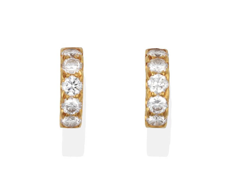 Lot 2012 - A Pair of Diamond Earrings, five round brilliant cut diamonds in yellow claw settings in each cuff