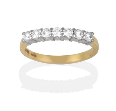 Lot 2017 - An 18 Carat Gold Diamond Half Hoop Ring, round brilliant cut diamonds in white claws on a...