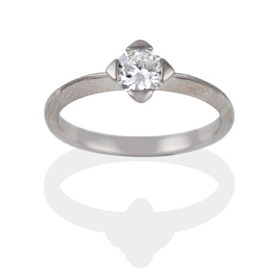 Lot 2028 - A Platinum Diamond Solitaire Ring, the round brilliant cut diamond in a white squared setting...