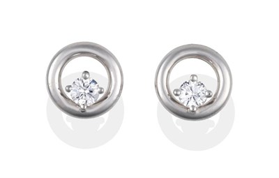 Lot 2030 - A Pair of 18 Carat White Gold Diamond Earrings, a round brilliant cut diamond claw set and...