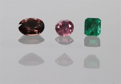 Lot 2054 - A Loose Oval Cut Red Brown Synthetic Colour Change Sapphire, of 1.33 carat approximately; A...