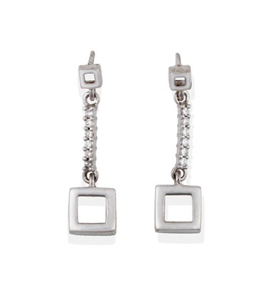 Lot 2068 - A Pair of 9 Carat White Gold Diamond Drop Earrings, an open-centred square suspends a row of...