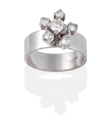 Lot 2069 - A Diamond Cluster Ring, a round brilliant cut diamond within a spaced border of mixed cut...