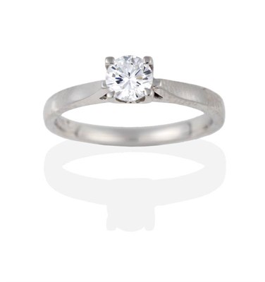 Lot 2072 - A Platinum Diamond Solitaire Ring, the round brilliant cut diamond in a four claw setting to...