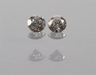Lot 2076 - Two Loose Round Brilliant Cut Diamonds, estimated diamond weight 0.61 carat and 0.58 carat...