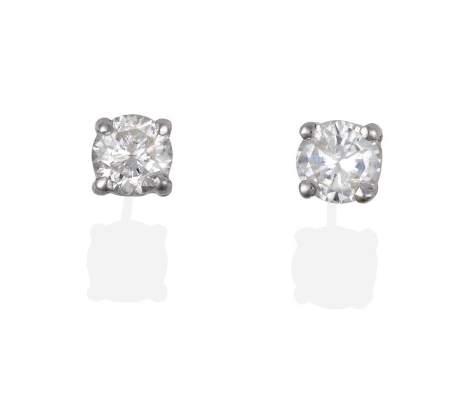 Lot 2081 - A Pair of Diamond Solitaire Earrings, round brilliant cut diamonds in claw settings, total...