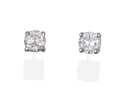 Lot 2081 - A Pair of Diamond Solitaire Earrings, round brilliant cut diamonds in claw settings, total...