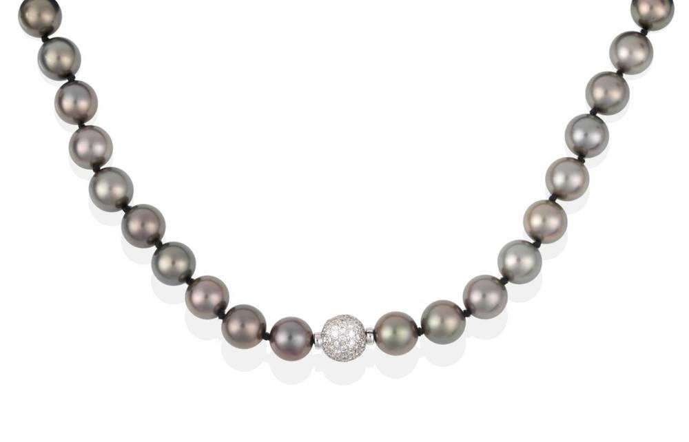 Lot 2091 - A Tahitian Cultured Pearl Necklace, with a Diamond Set Ball Clasp, total estimated diamond...