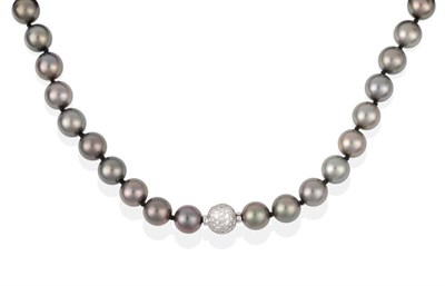 Lot 2091 - A Tahitian Cultured Pearl Necklace, with a Diamond Set Ball Clasp, total estimated diamond...