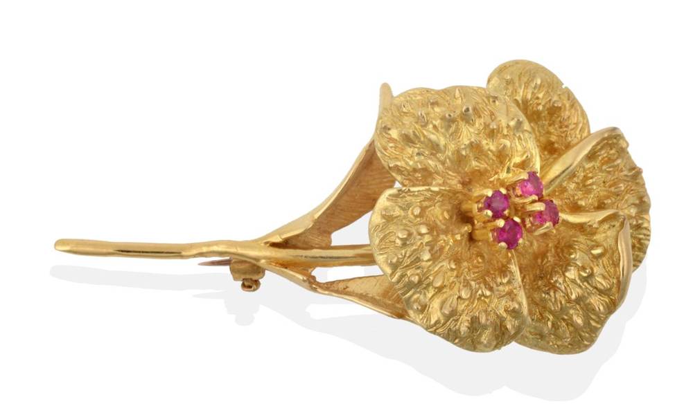Lot 2108 - An 18 Carat Gold Ruby Floral Brooch, four round brilliant cut rubies in yellow claw settings,...