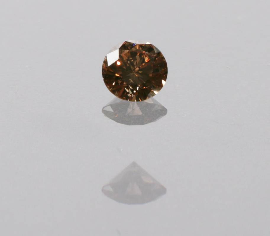 Lot 2111 - A Loose Round Brilliant Cut Cognac Diamond, estimated diamond weight 0.55 carat approximately