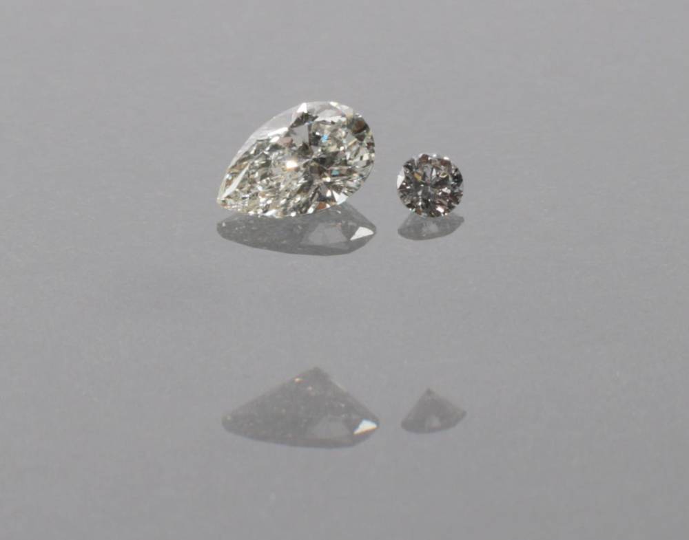 Lot 2113 - A Loose Pear Brilliant Cut Diamond, estimated diamond weight 0.39 carat approximately; and A...