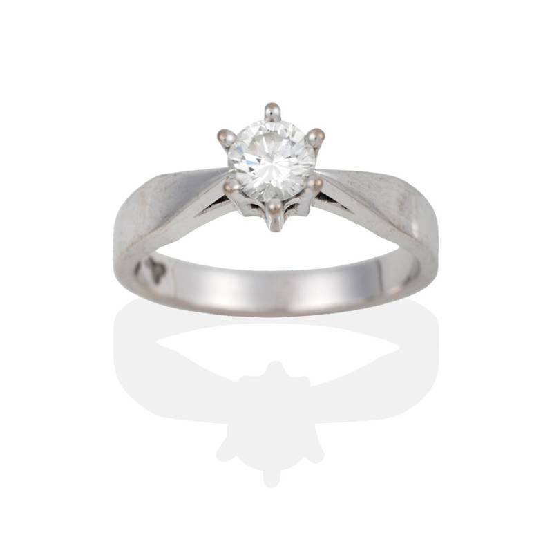 Lot 2118 - A Diamond Solitaire Ring, a round brilliant cut diamond in a white six claw setting, to pointed...
