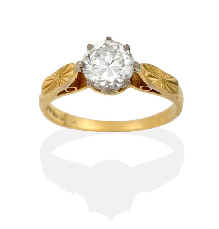Lot 2120 - An 18 Carat Gold Diamond Solitaire Ring, a round brilliant cut diamond in a white claw setting,...