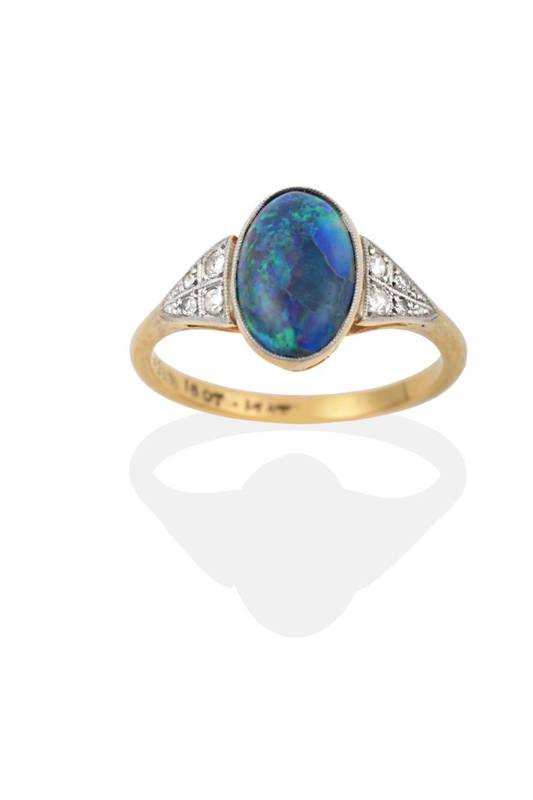 Lot 2122 - An Art Deco Opal and Diamond Ring, the oval cabochon opal in a white fronted millegrain setting, to