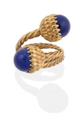 Lot 2130 - A Lapis Lazuli Torque Ring, designed by Schlumberger, for Tiffany, two lapis lazuli beads in...