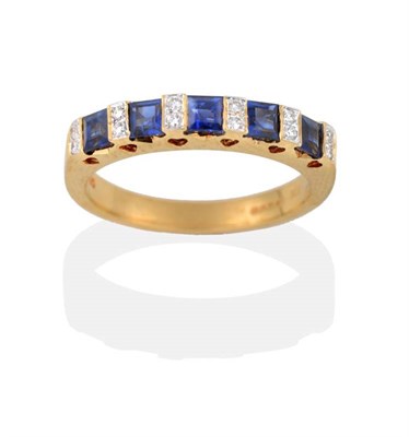 Lot 2144 - An 18 Carat Gold Sapphire and Diamond Half Hoop Ring, square step cut sapphires alternate with...