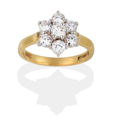Lot 2146 - An 18 Carat Gold Diamond Cluster Ring, seven round brilliant cut diamonds in white claws to a...