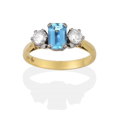 Lot 2148 - An 18 Carat Gold Aquamarine and Diamond Ring, the emerald-cut aquamarine between two round...