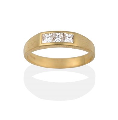Lot 2153 - An 18 Carat Gold Diamond Ring, three princess cut diamonds channel set within a yellow band...