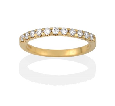 Lot 2161 - An 18 Carat Gold Diamond Half Hoop Ring, the round brilliant cut diamonds in yellow claw...