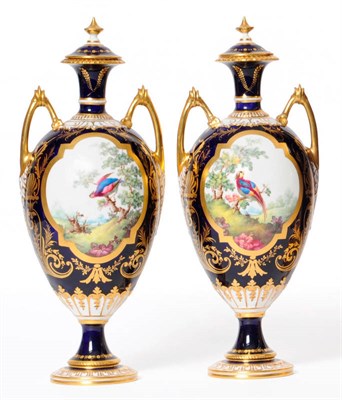 Lot 60 - A Pair of Royal Crown Derby Porcelain Baluster Vases and Covers, 1918, with high loop handles,...