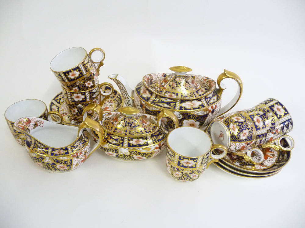 Lot 68 - A Royal Crown Derby Porcelain Teaset, 1909, decorated with an Imari type design, comprising an oval