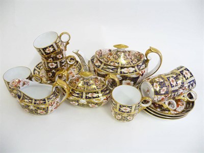 Lot 68 - A Royal Crown Derby Porcelain Teaset, 1909, decorated with an Imari type design, comprising an oval