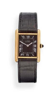 Lot 2297 - A Lady's Silver Gilt Wristwatch, signed Must de Cartier, circa 1990, lever movement, black dial...